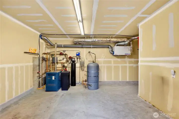 Mechanical room for radiant floor heating system located in the basement