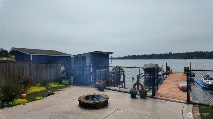 Great place to sit by the fire and enjoy all the sights on the lake. Stamped concrete in the back and no lawn to mow!