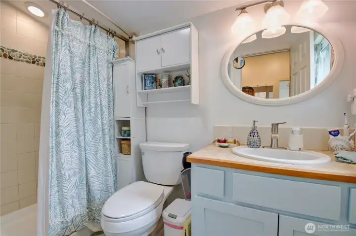Pretty bath with custom shower.