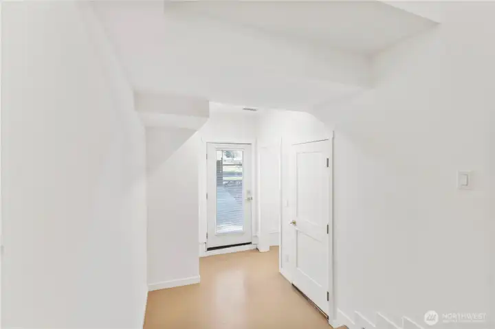 Hallway to backdoor and additional den Hallway to backdoor and additional den