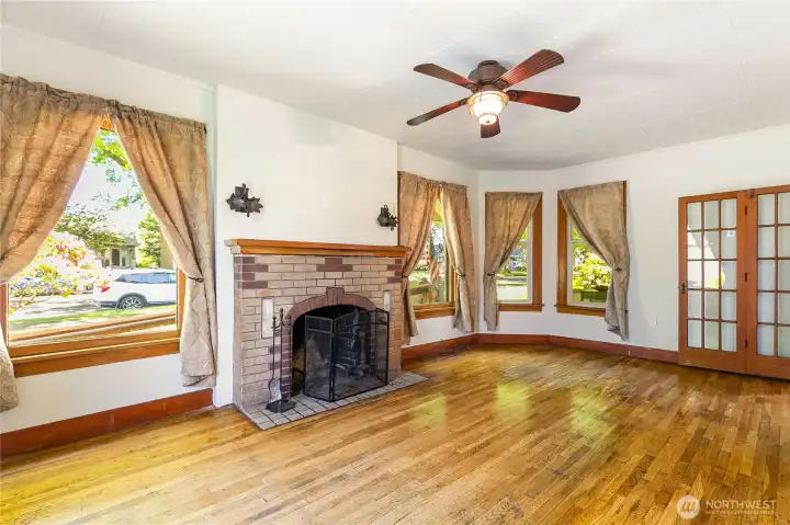 Living room off the front with a wood burning fireplace. Hardwood floors and amazing brick fireplace. Living room off the front with a wood burning fireplace. Hardwood floors and amazing brick fireplace.