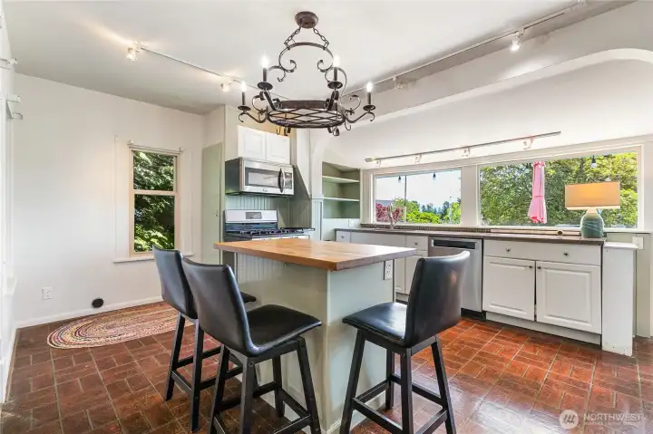 Kitchen island adds additional seating and also preparing meals. Kitchen island adds additional seating and also preparing meals.