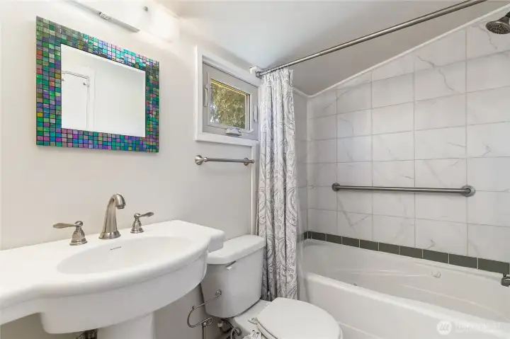 Full bathroom off the bedroom and the kitchen. Full bathroom off the bedroom and the kitchen.