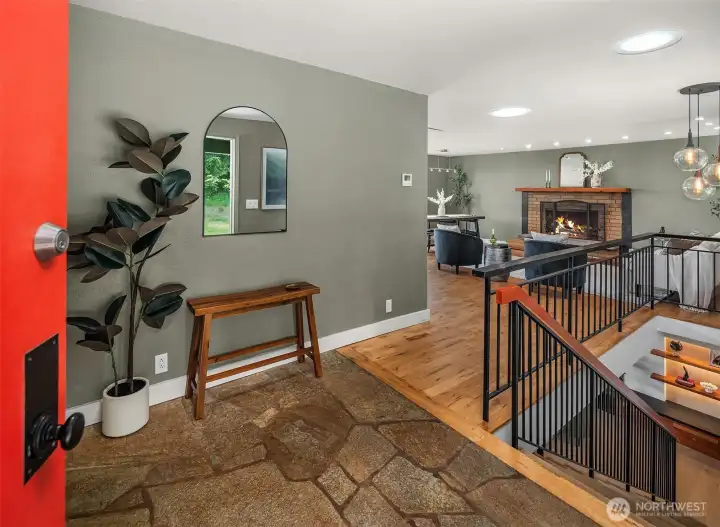 The open concept main level features a large living room, dining area, gorgeous kitchen, access to the deck, 2 bedrooms and a beautiful full bathroom.