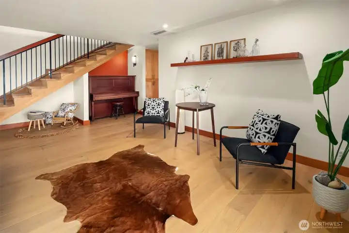 New engineered hardwood floors throughout the lower level.