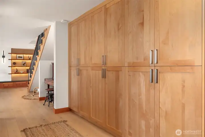 Newly installed storage cabinets in the lower level. Just the right amount of wood finishes!