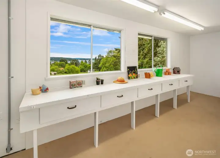You will find this bonus room through the garage. There is a wall of storage closets opposite the workbench. This room has an exterior entrance as well.
