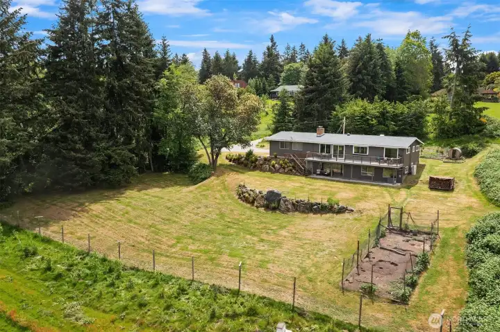 The terraced property has many opportunities for gardening, yard games, chicken farming, or leave it as is and watch the wildlife roam about.