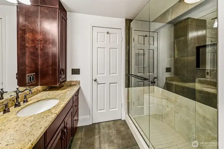 Full bathroom on the upper level includes a water closet and shower