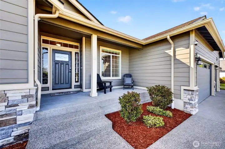 Welcoming covered front porch creates the perfect place to relax with a morning coffee while enjoying the peaceful neighborhood setting.