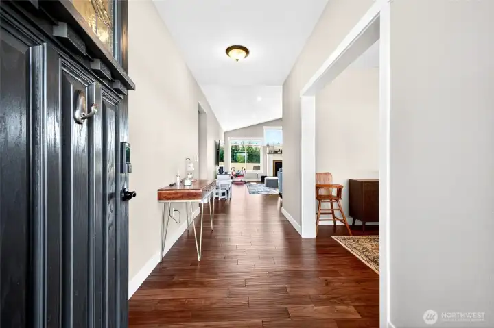 Grand entry welcomes you with rich hardwood flooring, soaring ceilings, and a bright open-concept design.
