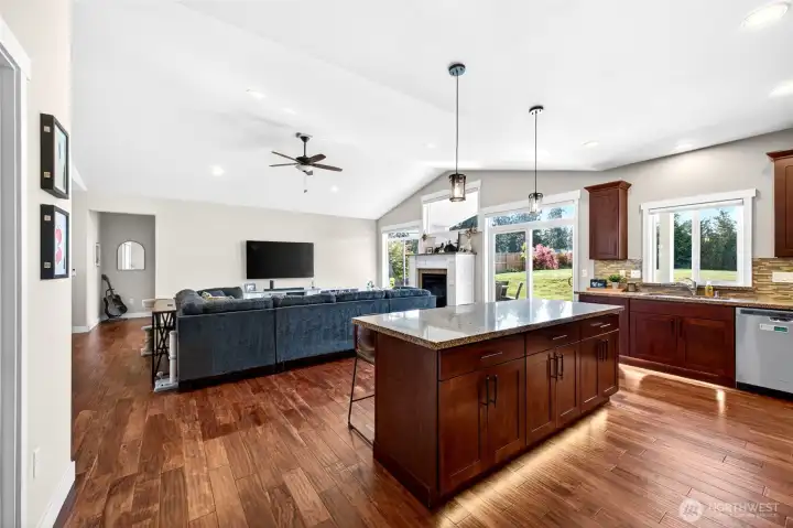 Open-concept design allows seamless flow between the kitchen, dining, and living spaces while keeping everyone connected.