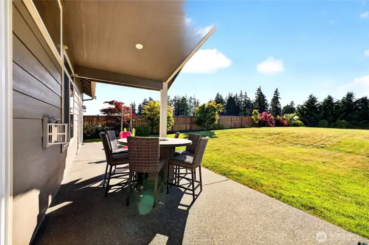 Covered outdoor living area perfect for year-round entertaining, dining, and relaxing.
