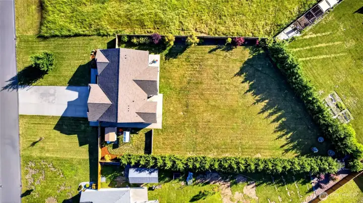 Bird’s-eye view showcasing the impressive fully fenced lot, expansive backyard, and exceptional privacy.