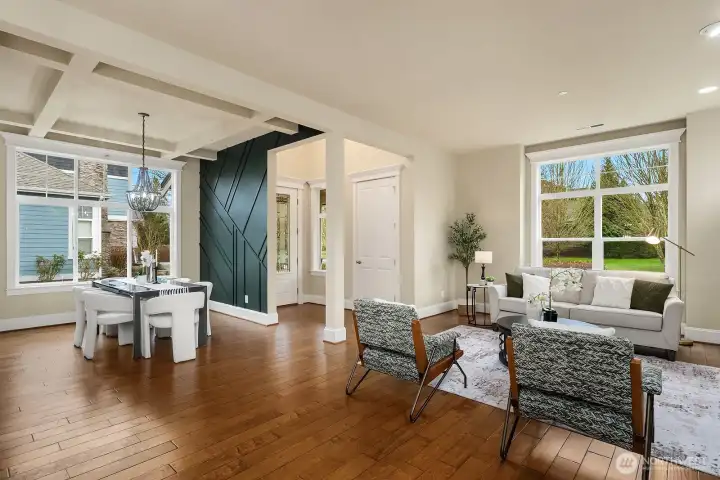 A stylish barn door adds a charming architectural detail to this versatile flex space, which flows openly between the living areas and offers rich hardwood floors, abundant natural light, and a warm, inviting atmosphere. A stylish barn door adds a charming architectural detail to this versatile flex space, which flows openly between the living areas and offers rich hardwood floors, abundant natural light, and a warm, inviting atmosphere.