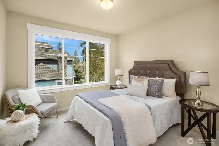 One of the generously sized secondary bedrooms offers a bright and comfortable retreat with a large window, soft neutral tones, and plenty of space — ideal for guests, family, or a dedicated home office. One of the generously sized secondary bedrooms offers a bright and comfortable retreat with a large window, soft neutral tones, and plenty of space — ideal for guests, family, or a dedicated home office.