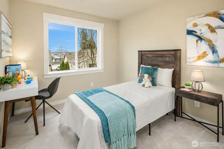 Another well-appointed secondary bedroom features warm carpeting, a bright window with lovely views, and a cozy, versatile layout — a comfortable and inviting space for family or guests. Another well-appointed secondary bedroom features warm carpeting, a bright window with lovely views, and a cozy, versatile layout — a comfortable and inviting space for family or guests.