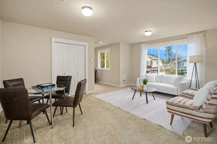 The bright and versatile ADU living area offers a comfortable and functional open layout with a dining space, large window, and a separate entrance — an ideal setup for rental income, guests, or multigenerational living. The bright and versatile ADU living area offers a comfortable and functional open layout with a dining space, large window, and a separate entrance — an ideal setup for rental income, guests, or multigenerational living.