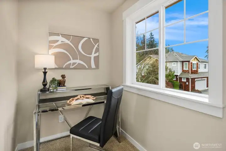 The ADU's private bedroom doubles beautifully as a home office, featuring a bright window with lovely neighborhood views and a clean, versatile layout — a comfortable and functional space within this exceptional above-garage unit. The ADU's private bedroom doubles beautifully as a home office, featuring a bright window with lovely neighborhood views and a clean, versatile layout — a comfortable and functional space within this exceptional above-garage unit.