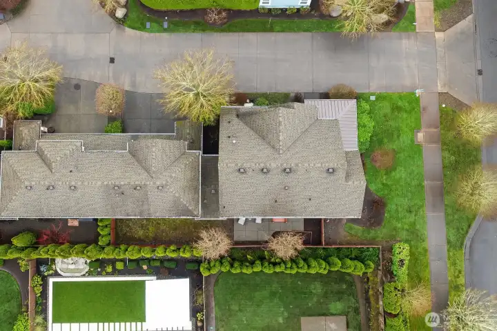 A top-down aerial perspective highlights the generous corner lot, fully fenced yard, private patio, and the home's thoughtful layout — showcasing just how much this exceptional property has to offer inside and out. A top-down aerial perspective highlights the generous corner lot, fully fenced yard, private patio, and the home's thoughtful layout — showcasing just how much this exceptional property has to offer inside and out.