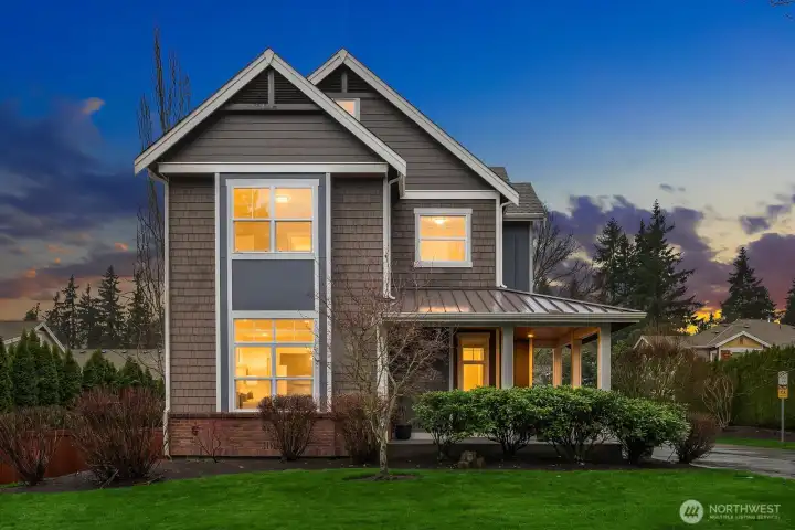 A breathtaking dusk shot captures the home's stunning curb appeal, with warm light glowing from within, classic Craftsman architecture, and lush landscaping — a truly picture-perfect welcome to this exceptional Sycamore Park property. A breathtaking dusk shot captures the home's stunning curb appeal, with warm light glowing from within, classic Craftsman architecture, and lush landscaping — a truly picture-perfect welcome to this exceptional Sycamore Park property.