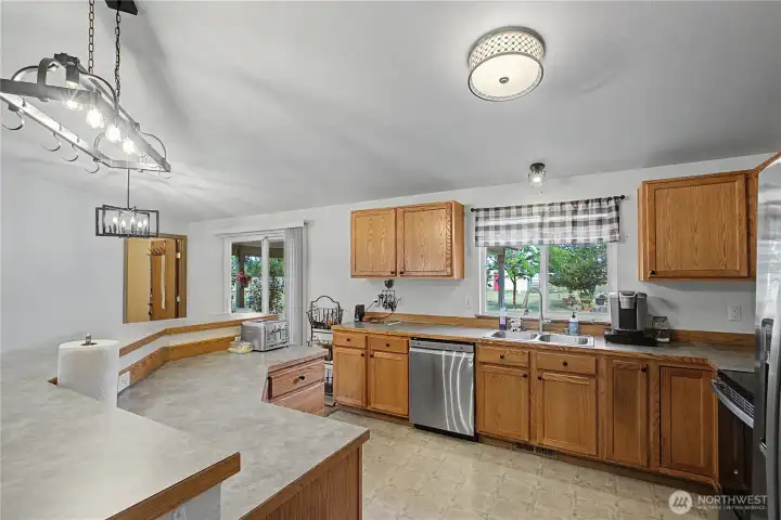 A look into this great sized kitchen. Tons of cupboard space and eat-at bar too! A look into this great sized kitchen. Tons of cupboard space and eat-at bar too!