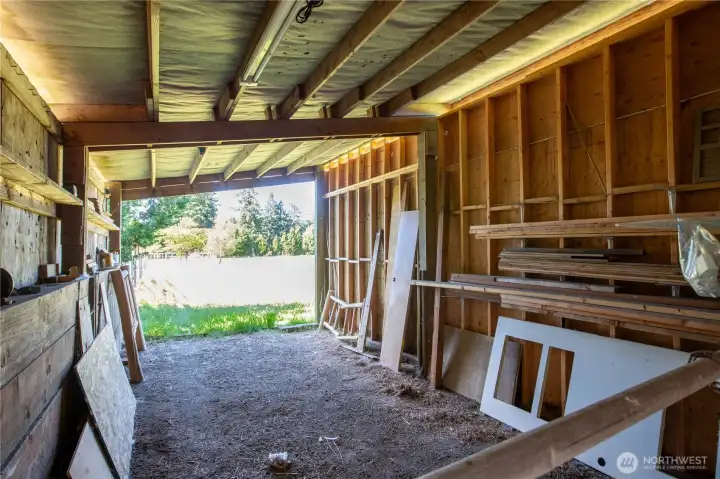 Inside the 2-stall stable. The divider has been removed but can easily be put back. Inside the 2-stall stable. The divider has been removed but can easily be put back.