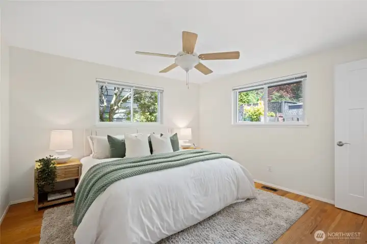 Spacious primary suite filled with natural light and peaceful backyard views. Spacious primary suite filled with natural light and peaceful backyard views.