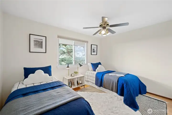 Spacious upstairs bedroom with large windows and plenty of room to personalize. Spacious upstairs bedroom with large windows and plenty of room to personalize.