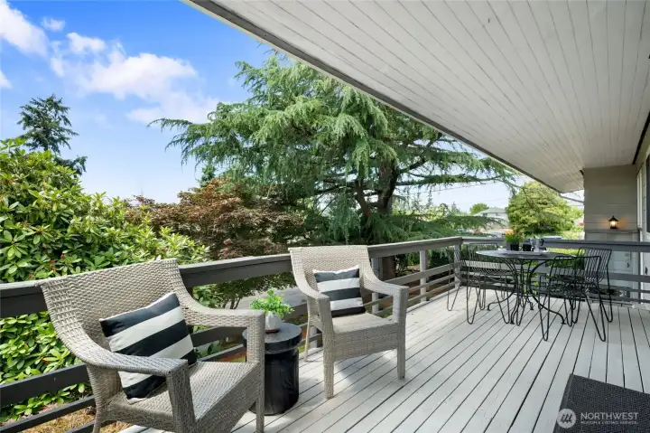 Enjoy morning coffee or sunset dinners on the large deck overlooking mature landscaping. Enjoy morning coffee or sunset dinners on the large deck overlooking mature landscaping.