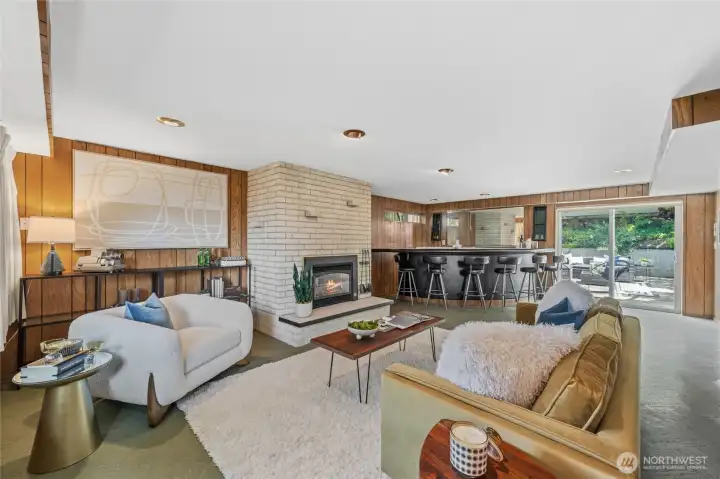 Gather around the cozy fireplace or entertain guests in the nostalgic recreation room with its classic wet bar. Gather around the cozy fireplace or entertain guests in the nostalgic recreation room with its classic wet bar.