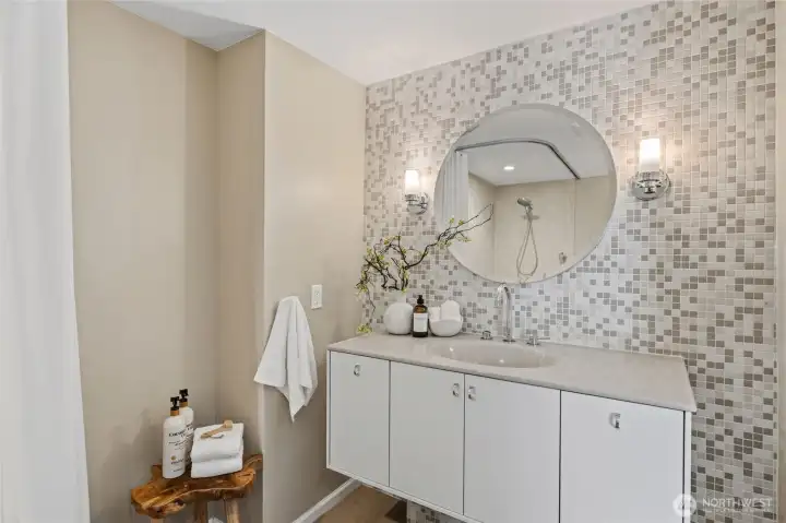 Updated lower-level bath features a modern vanity and stylish contemporary finishes. Updated lower-level bath features a modern vanity and stylish contemporary finishes.