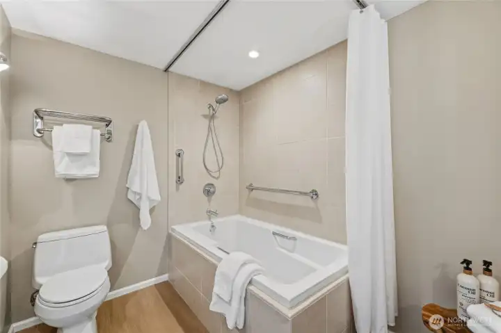 Remodeled full bath with a tiled tub/shower combination and clean, modern design. Remodeled full bath with a tiled tub/shower combination and clean, modern design.