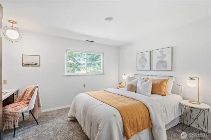 Comfortable lower-level bedroom with new carpet, built-in vanity, and abundant storage. Comfortable lower-level bedroom with new carpet, built-in vanity, and abundant storage.