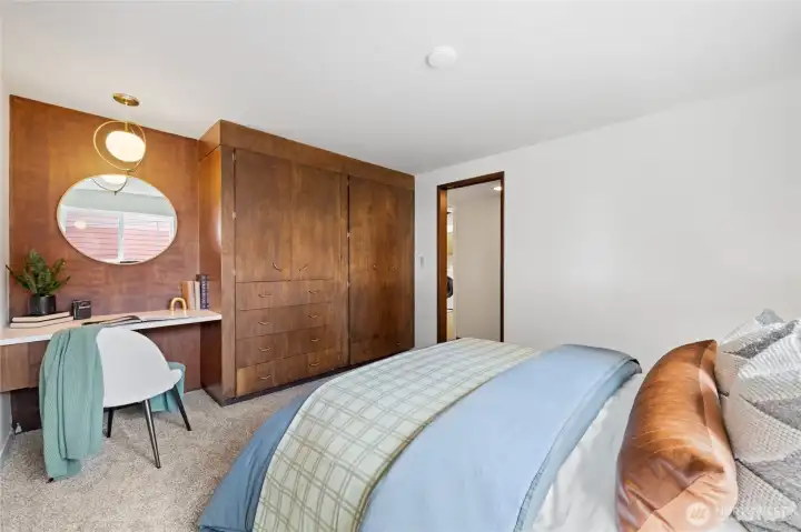 Generous closet storage and built-in vanity make this bedroom both practical and inviting. Generous closet storage and built-in vanity make this bedroom both practical and inviting.