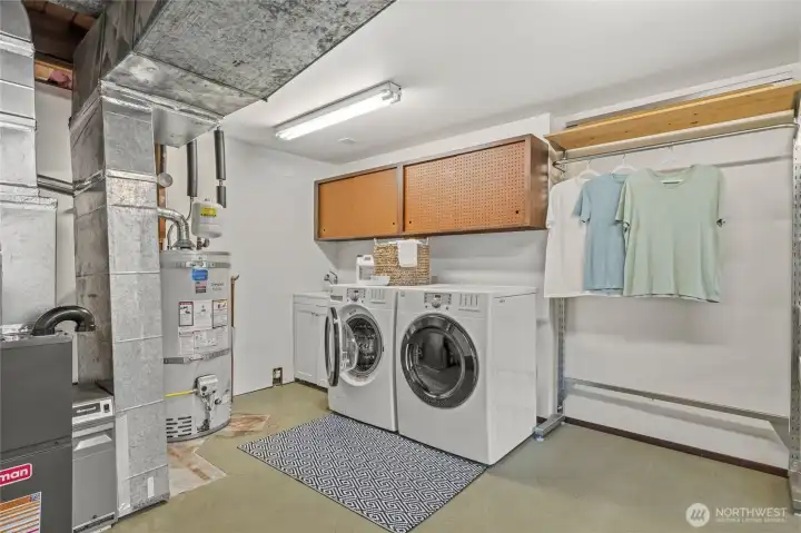 Oversized utility room with laundry, abundant storage, and a new furnace and hot water tank. Oversized utility room with laundry, abundant storage, and a new furnace and hot water tank.