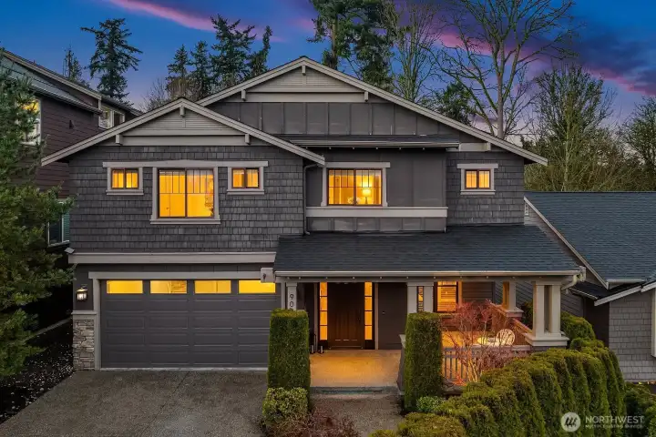 Beautiful Craftsman home in the sought-after Finn Hill/Juanita neighborhood of Kirkland, WA, featuring timeless architecture, manicured landscaping, a covered front porch, and an oversized two-car garage.