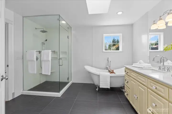 Primary bath with claw foot tub, stand alone shower, dual sinks and heated floors Primary bath with claw foot tub, stand alone shower, dual sinks and heated floors