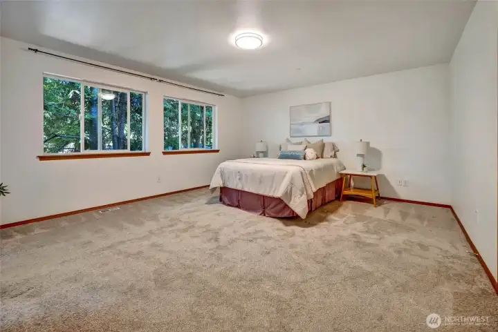 Spacious primary suite with room for king bed, dresser and nightstands Spacious primary suite with room for king bed, dresser and nightstands