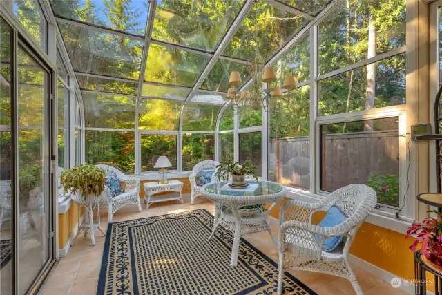 Sun-room opens to the spacious rear deck.