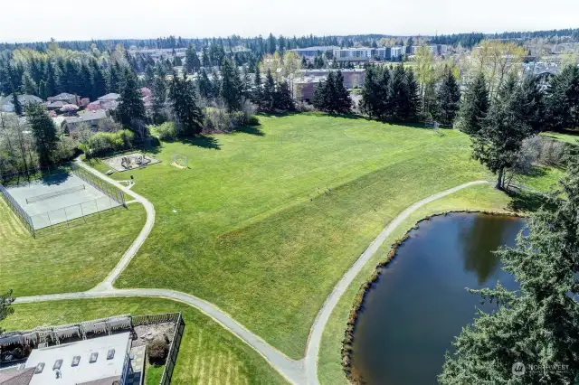 Trail Lake park with Tennis Court, play gym, soccer field and the baseball backstop.