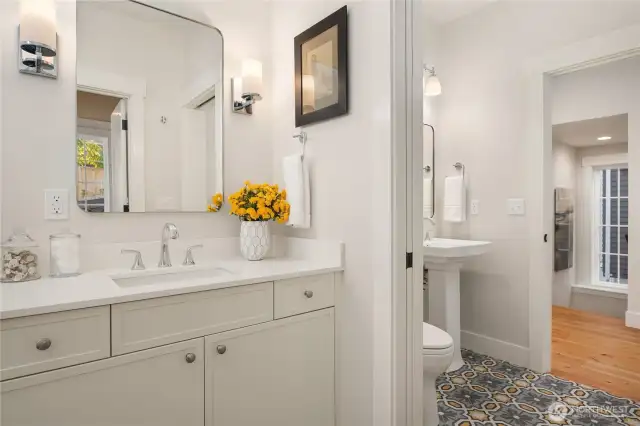 A large main floor heated tile bath adjoins the main floor bedroom.