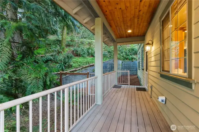 Covered back deck with access to fully fenced dog run