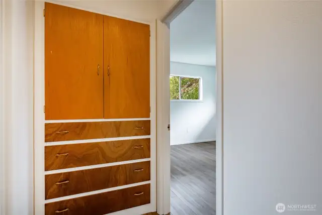 End of hallway with built-in cabinet.