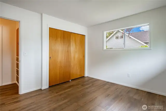 Bedroom 3 with newer vinyl flooring.