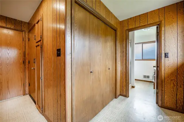 Lots of storage closets between kitchen and garage plus 3/4 bathroom.