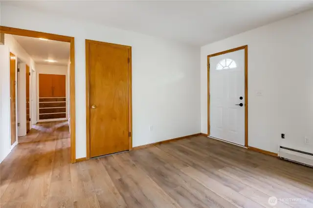 Main entry into living room with coat closet, hallway leads to 3 bedrooms & hall bathroom.