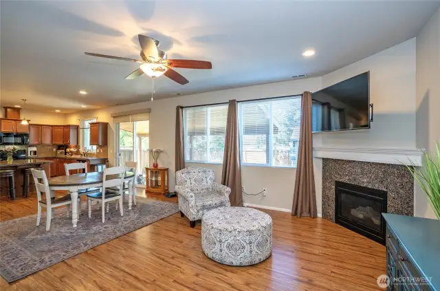 Oversized double windows brighten the family room and provide a lovely view of the covered patio and fully fenced yard.