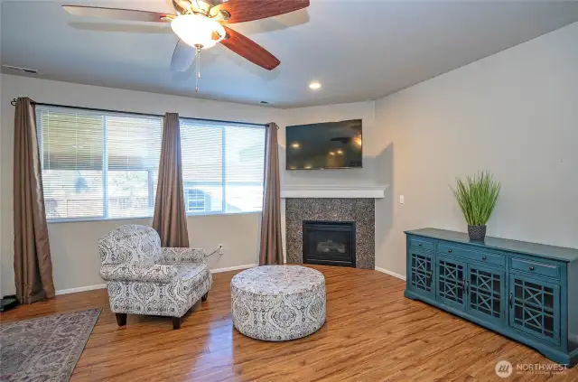 A gas fireplace adds warmth and charm to the family room, making it an ideal spot to unwind.