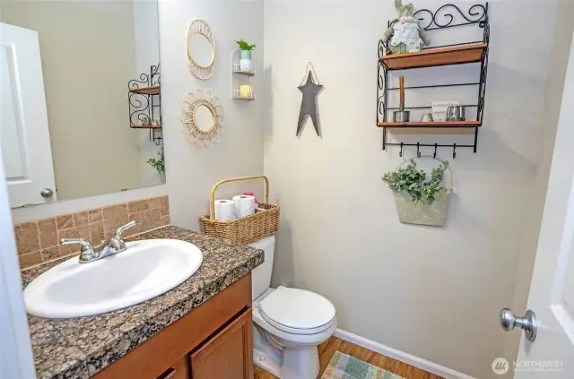 Main-level powder room provides easy access and added comfort for family and guests.